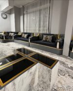 Diwanzane’s black and gold Arabic Majlis, featuring sleek, modern seating with luxurious cushions, perfect for a chic and elegant lounge area.
