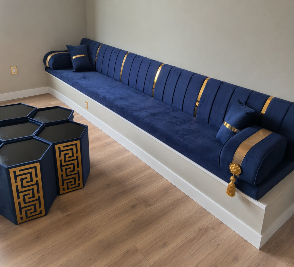 Blue velvet diwan sofa installed in a Rochester Hills Michigan home with gold accents