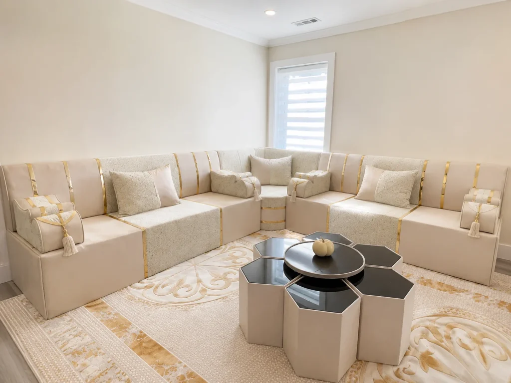 Custom cream and gold diwan sofa in a bright modern Majlis room